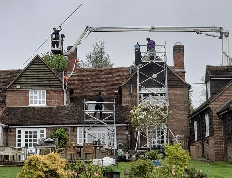 The Roof Moss Cleaners using cherry picker and scaffolding to clean roof safely and professionally in Didcot, Oxfordshire