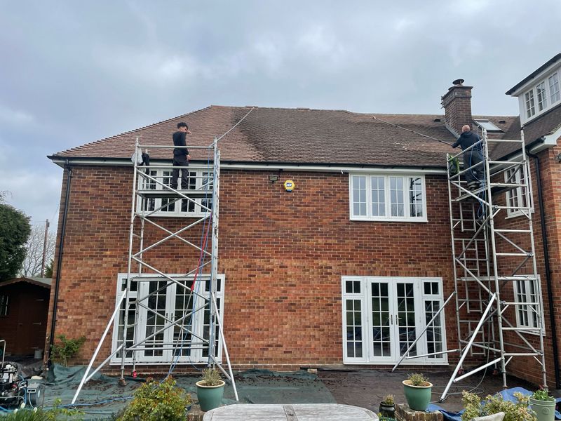 Roof cleaning carried out safely from scaffold towers by The Roof Moss Cleaners in Didcot